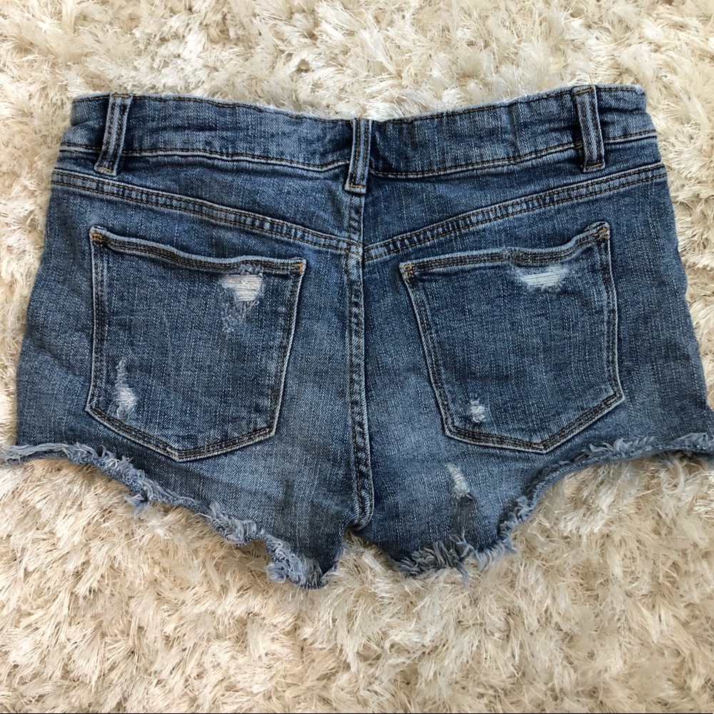Zara medium wash distressed jean shorts